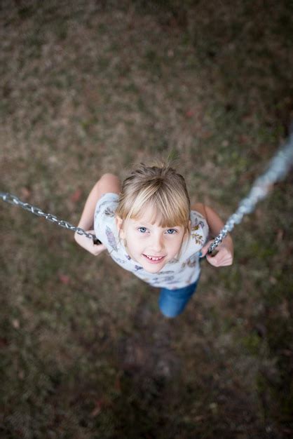 Premium Photo Portrait Of Cute Girl On Swing