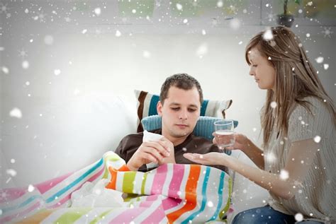 Premium Photo Caring Girlfriend Giving His Sick Boyfriend Pill