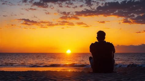 premium ai image man watching sunset  beach
