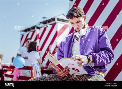 Serious Brunette Man Trying To Read Book Stock Photo Alamy
