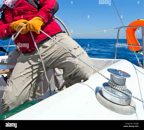 Man Holding Rope On Sailing Boat Stock Photo Alamy