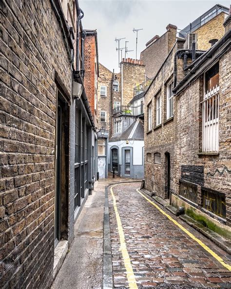 A Historic Cobblestone Street In Londons Fitzrovia On A Rainy Day