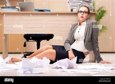 Businesswoman Under Stress From Too Much Work In The Office Stock Photo