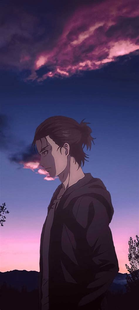 a man standing in front of a sunset with his back to the camera, looking at something