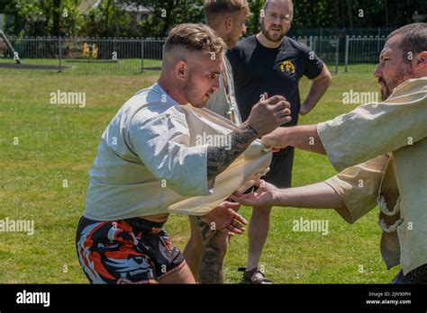 Coaches Teaching The Rules And Techniques Of Cornish Wrestling Before