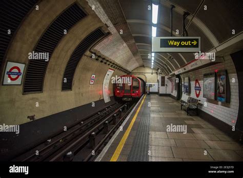 London Underground Train Leaving Lancaster Gate Tube Station In London Empty Platform With Way