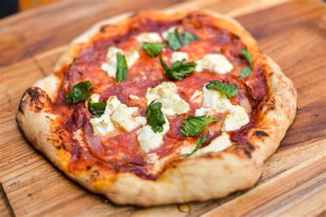 Homemade Pizza With Hot Soppressata Mozzarella Ricotta And Basil