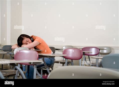 Student sleeping on her desk Stock Photo - Alamy