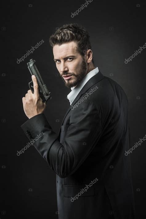 Confident Undercover Agent With Gun Stock Photo Stokkete 64402363