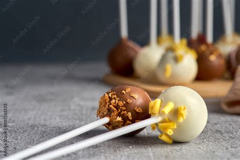 Selection of various bonbon in close up.Tasty sweet dessert food for lunch on a gray stone ...