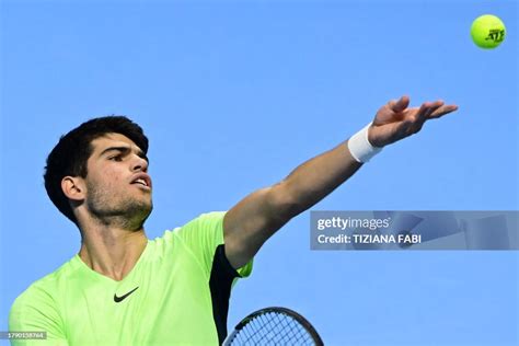 Spains Carlos Alcaraz Serves To Serbias Novak Djokovic During Their