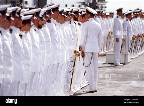 The Captain Inspects Uniformed Divisions Of Sailors On The HMS