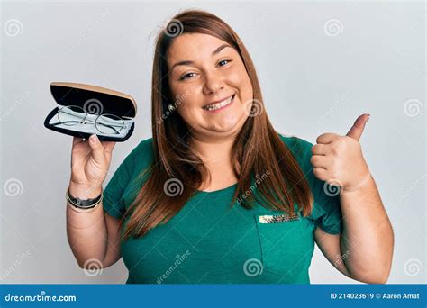Beautiful Brunette Plus Size Woman Holding Glasses In Eyewear Case Pointing Thumb Up To The Side