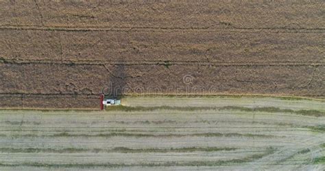 Machinery Harvesting Crops on Field Stock Image - Image of land ...