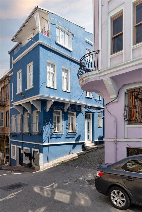 Cobblestone Alley With Beautiful Old Traditional Blue House In Balat