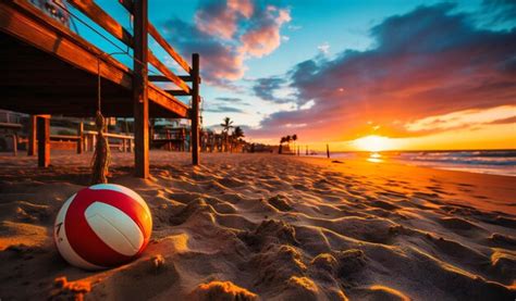 Premium AI Image | A volleyball net set up on sand at sunset