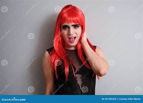 Portrait Of Gender Fluid Male Dressed As Female Smiling And Looking At