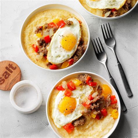 Sausage And Eggs Over Cheddar Parmesan Grits Recipe Taste Of Home