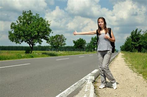 Young Girl Hitchhiking On The Road Stock Image Image Of Clouds Hitchhike 14540211