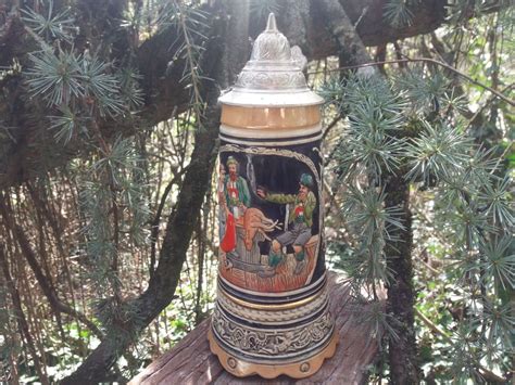 ANCIENNE CHOPE DE BIÈRE CÉRAMIQUE AVEC BOITE À MUSIQUE REUGE Acheter