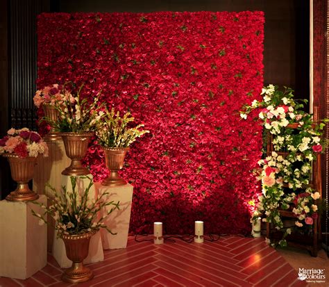 Glamorous Red Rose Wall With Minimal Florals For The Reception Photo