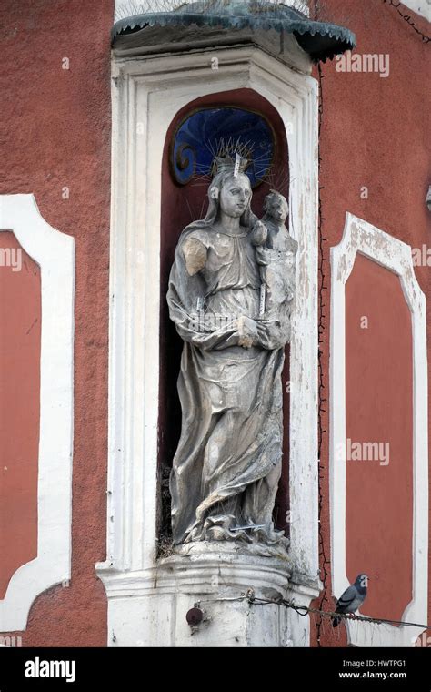 Virgin Mary With Baby Jesus Statue On The House Facade In Ptuj Town