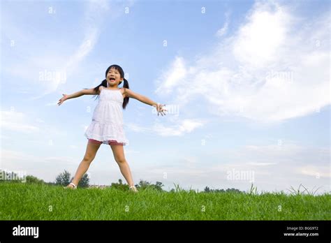 Girl Standing With Her Arms Stretched Out Hi Res Stock Photography And