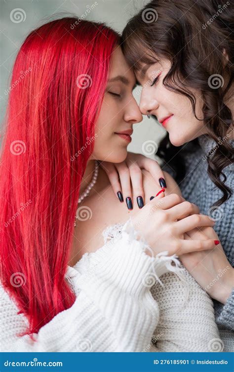 Portrait Of Two Tenderly Hugging Women Dressed In Sweaters Lesbian