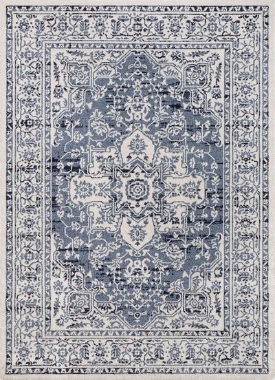 A Blue And White Rug With An Ornate Design