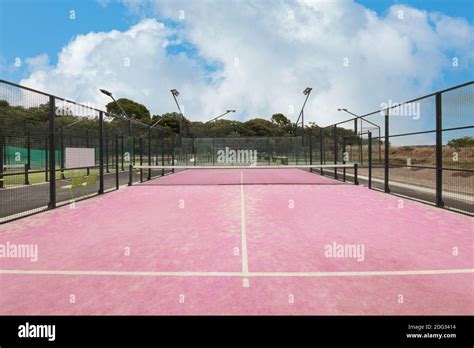 Pink tennis court with sky color Stock Photo - Alamy