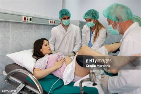 Woman Screaming Giving Birth Photos and Premium High Res Pictures ...