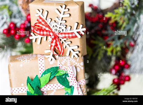 Christmas Gifts Wrapped In Brown Paper With Red Ribbons Stock Photo Alamy