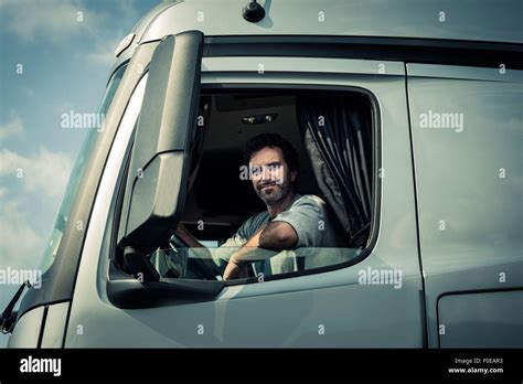 Truck driver with tractor trailer truck Stock Photo - Alamy