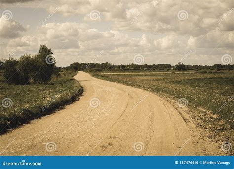 Country Gravel Road With Old And Broken Asphalt Vintage Retro Look