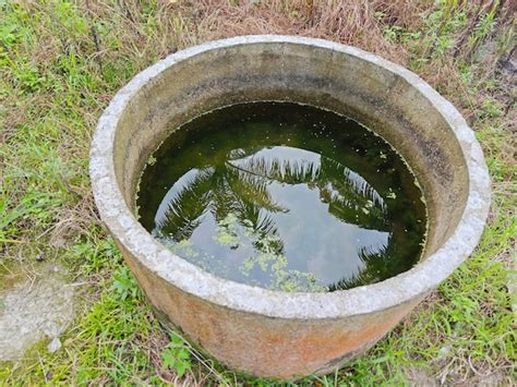 Premium Photo Looking Down On The Surface Of Cylindrical Concrete Well