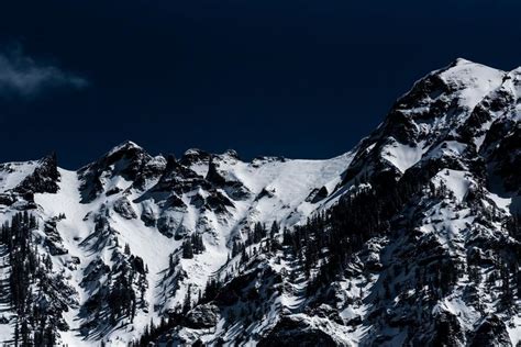 Free Stock Photo Of Majestic Snow Covered Mountain Under Dark Sky