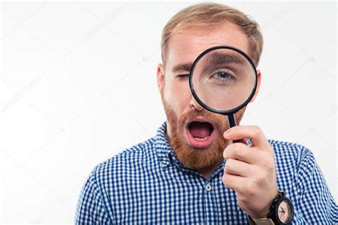 Person Looking Through Magnifying Glass