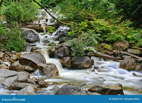 Rushing Water Over Rocks In A Creek Stock Photos Image 25822723