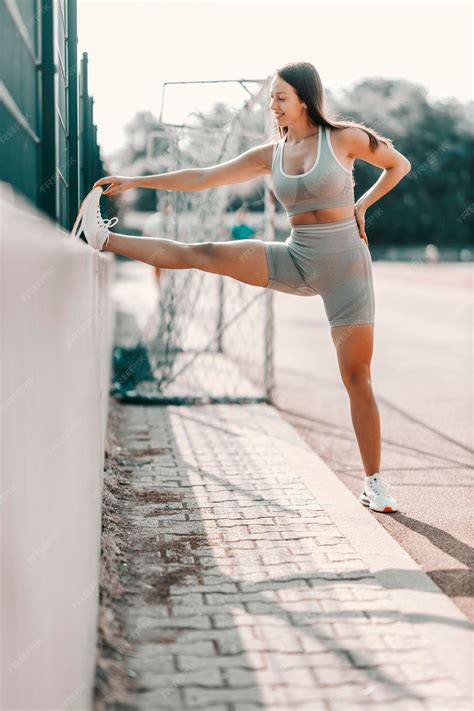 Premium Photo | Stretching leg muscles in training