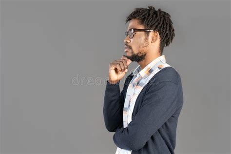 Portrait Of Young Pensive African American Man Posing In Glasses