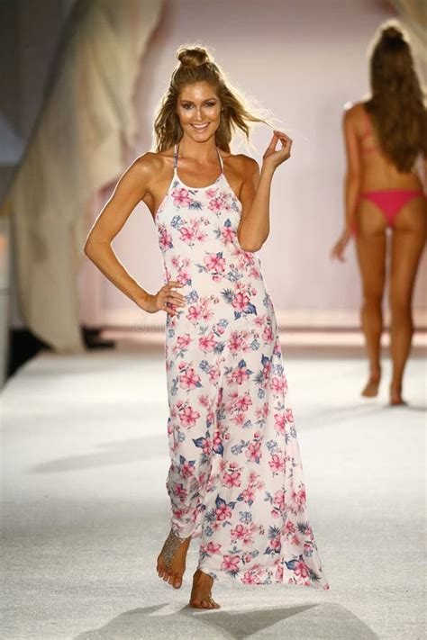 A Model Walks Runway In Designer Swim Apparel During The Frankies