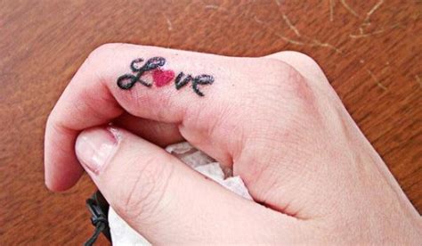 Love Tattoo On Finger Tattoo Designs Tattoo Pictures