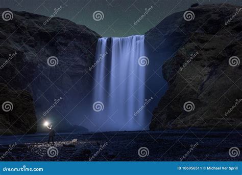 A Hike Standing Below Skogafoss Waterfall at Night Stock Image - Image ...