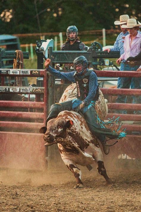 Vertical Shot Of A Cowboy Riding A Bull At The Wyandotte County Kansas