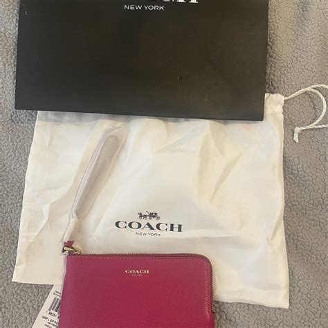 Coach wristlet - pink colour Brand new - comes with bag - Depop