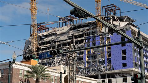 Firefighters Shield Body Trapped In Rubble Of New Orleans Hotel The