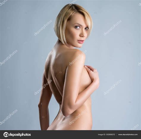 Naked Woman Looking Over Her Shoulder Coquettishly Stock Photo By