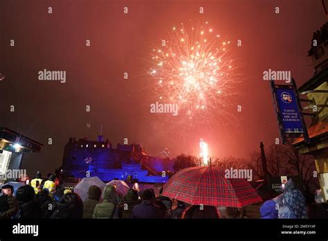 Revellers watch fireworks at Edinburgh Castle during the Hogmanay New ...