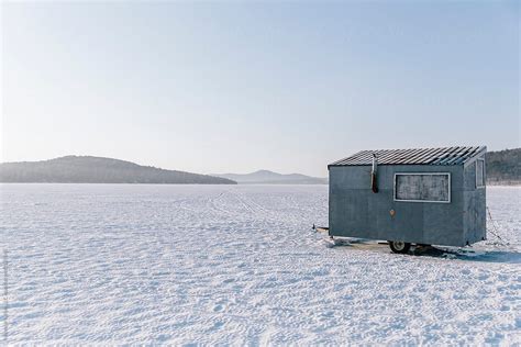 Ice Fishing Hut On Lake On Frozen Winter Landscape Morning By Stocksy