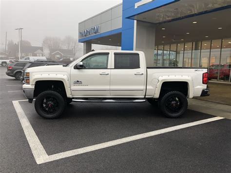 🚨Check out this beast of a 2014 Chevy Silverado! Lifted, off road tires and lots more options ...